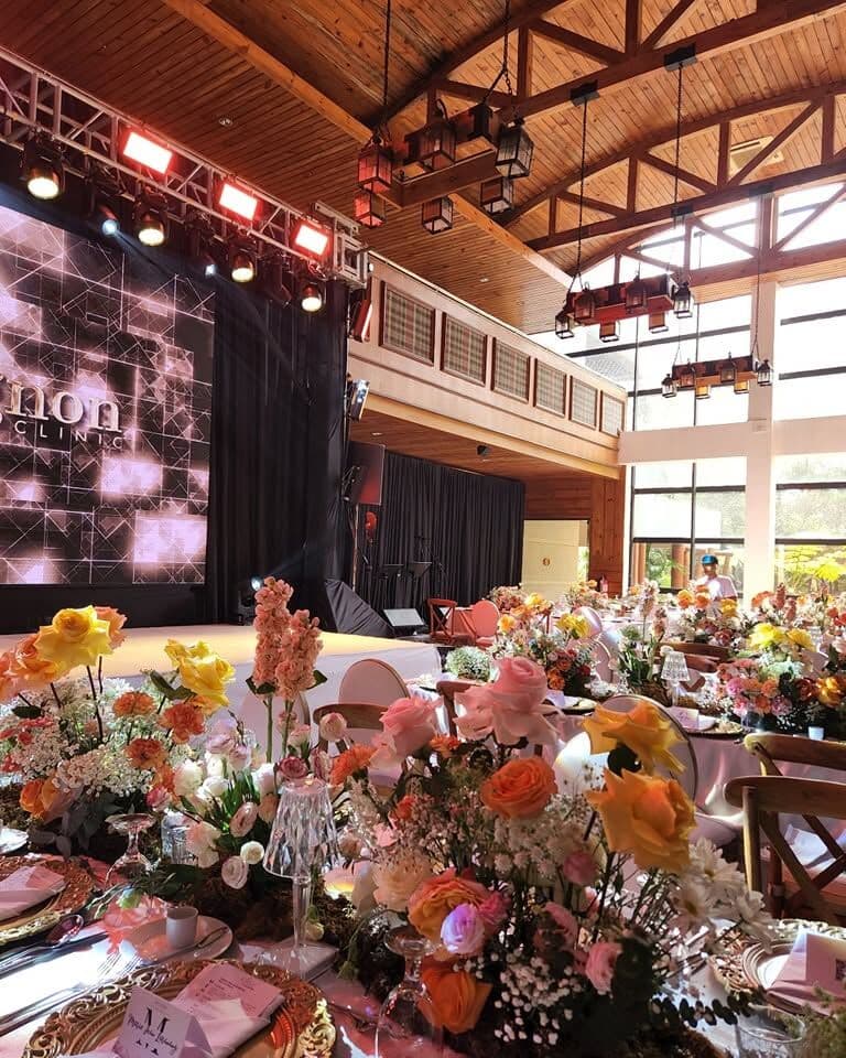 A styled corporate dinner in a timber hall