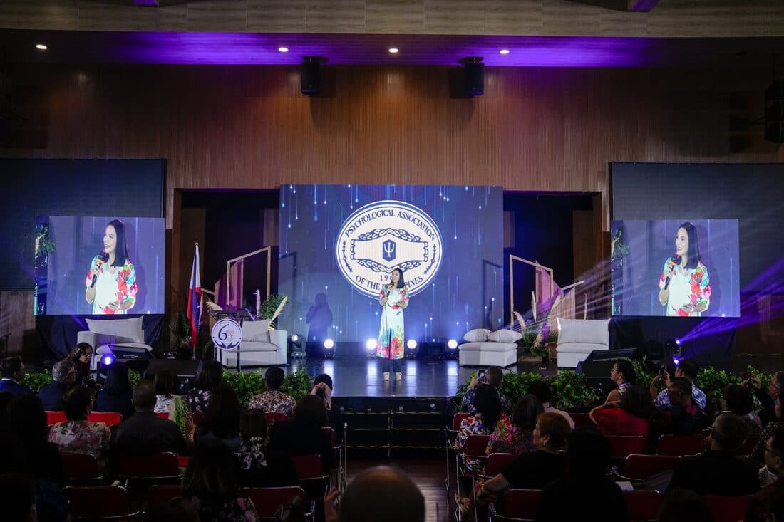 A speaker on the plenary stage