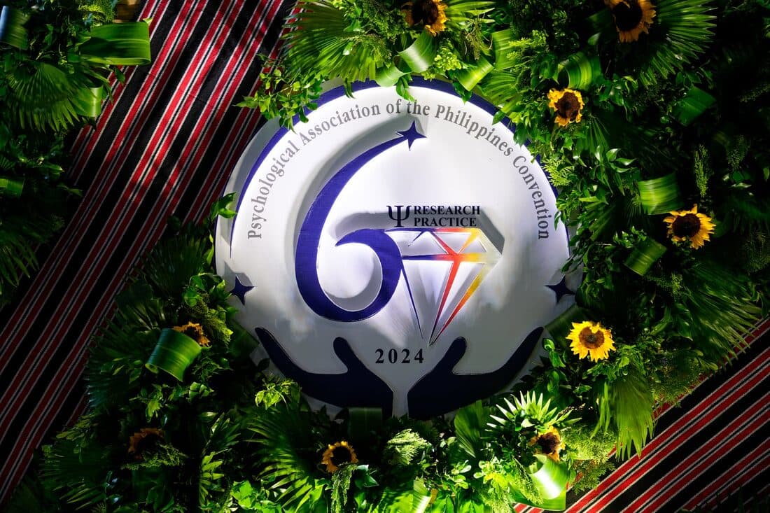 The anniversary emblem set into foliage