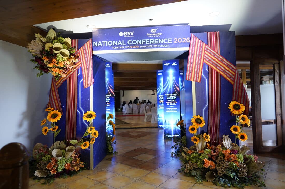 The conference entrance, flanked in sunflowers