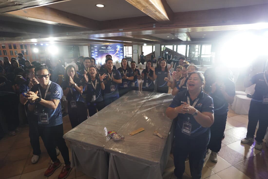 Delegates crowded around a workshop table