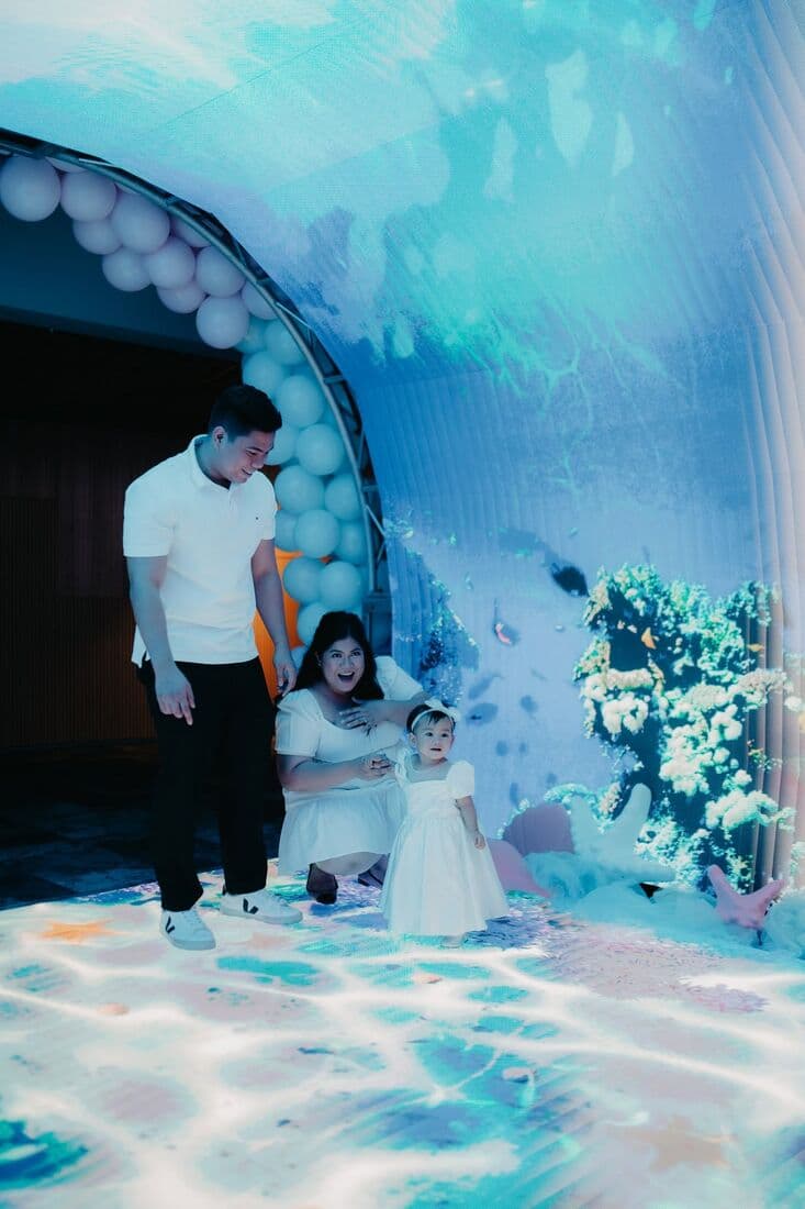Children playing on a mermaid-themed floor