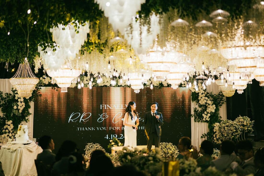 A ballroom draped in white florals