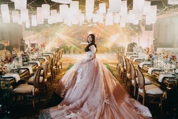 A bride crossing an empty ballroom