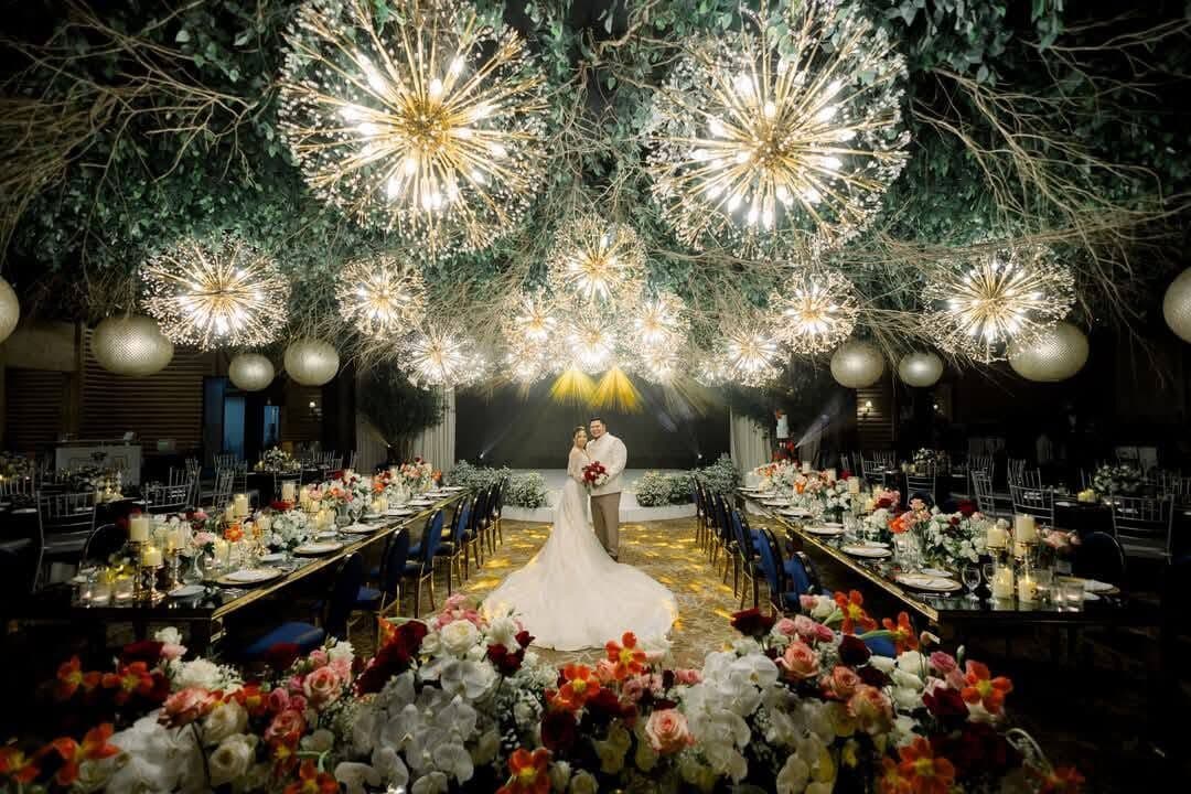 A bride in a hall of starburst lights