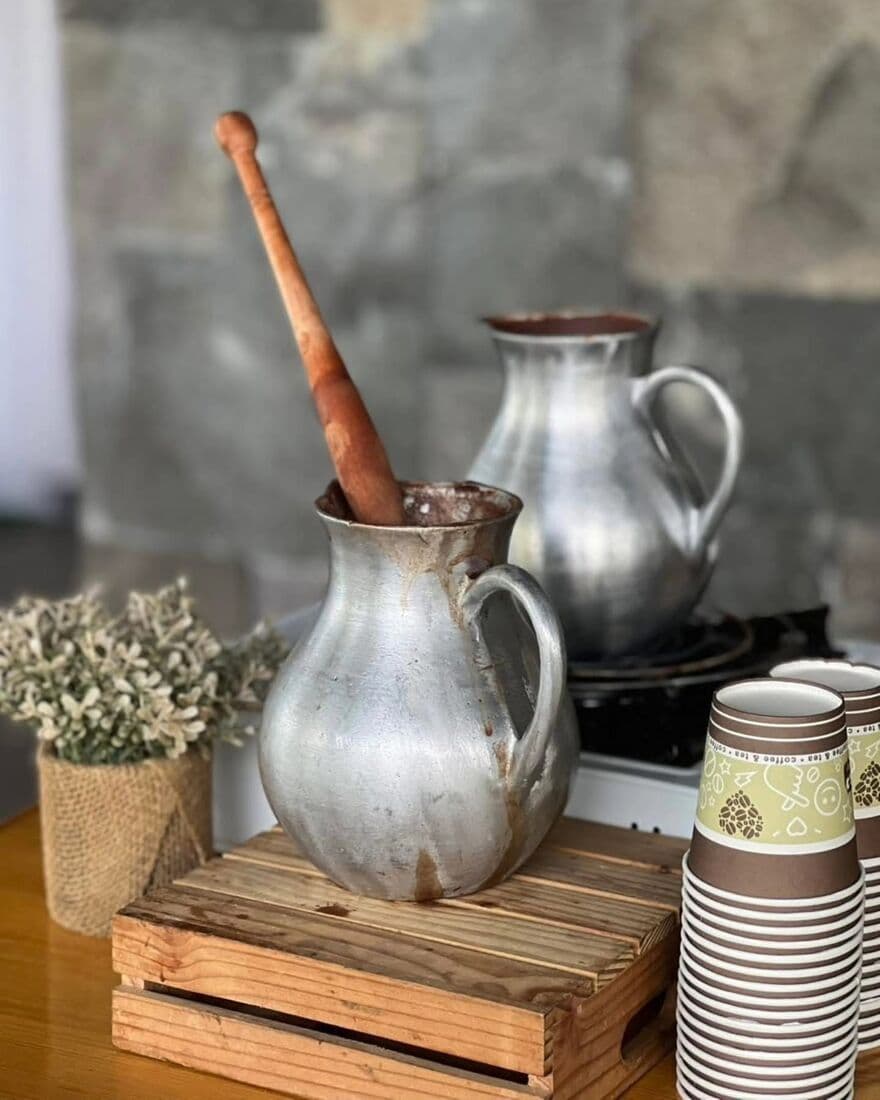 Pewter pitchers and gypsophila on a bar