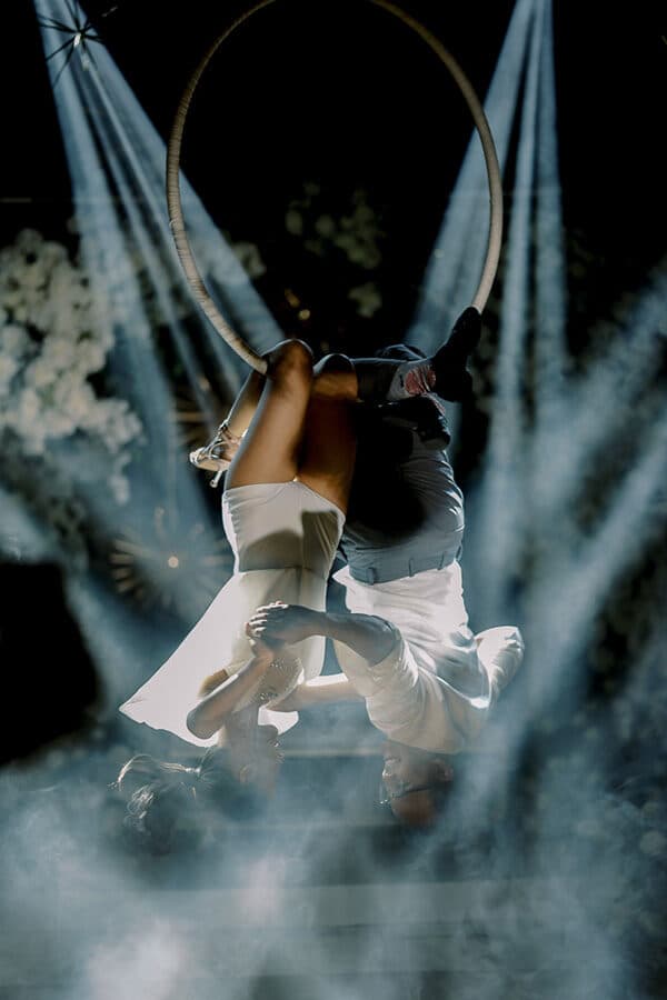 Aerial performers on a hoop above the floor
