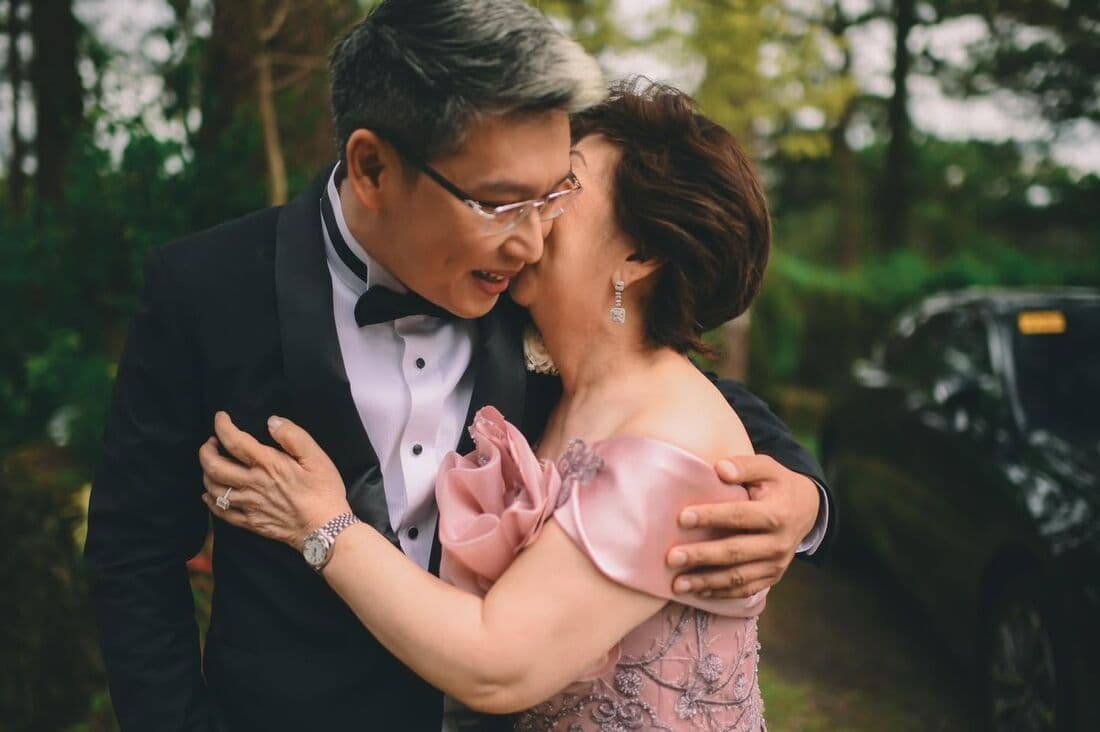 The couple's parents dancing together