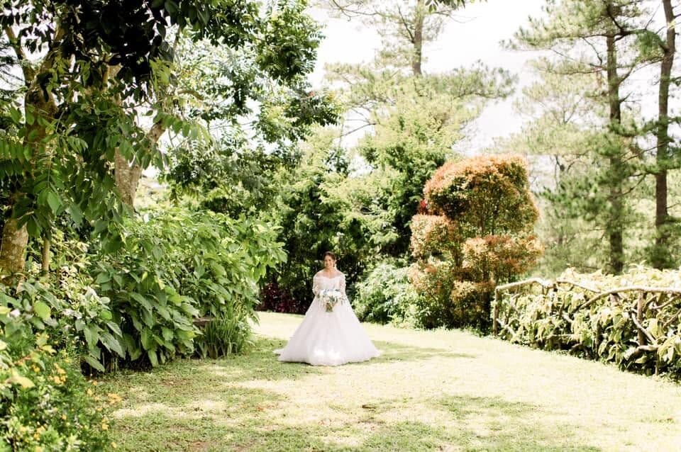 A bride alone in a garden