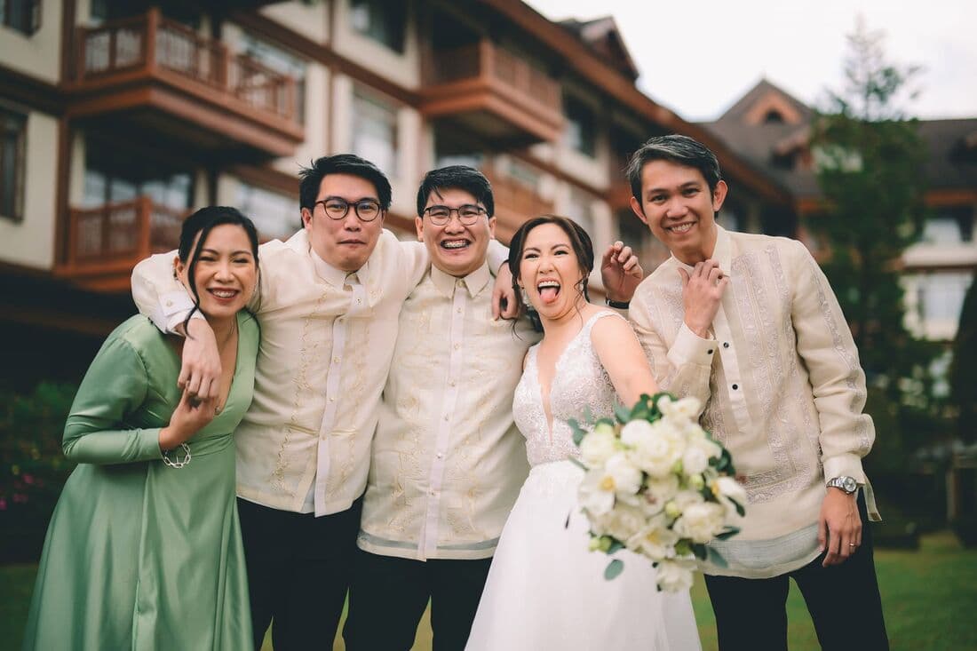 A couple with friends in barong