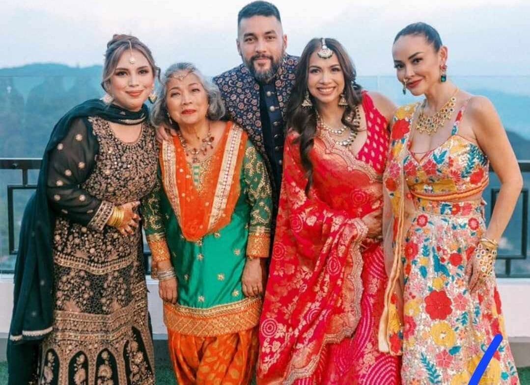 Women in bright saris at an Indian wedding