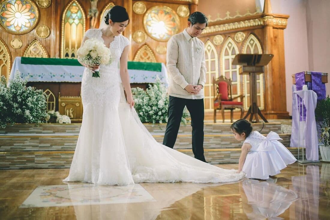 A couple at the altar of a stone church