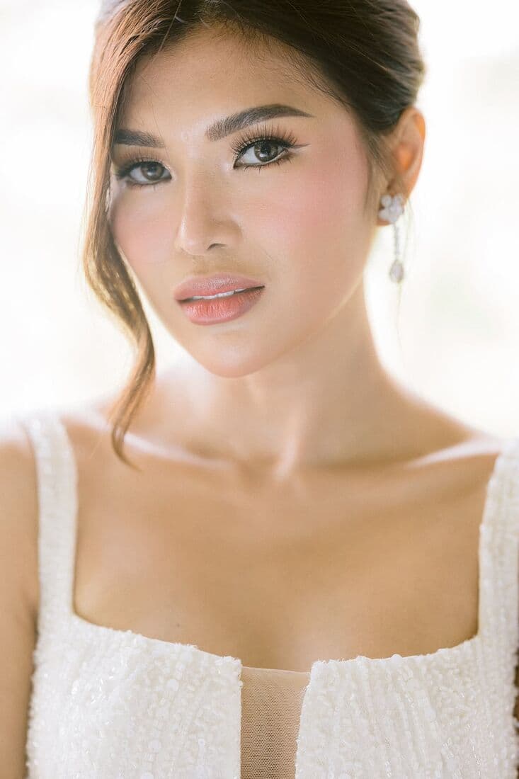 Portrait of a bride in a square-neck gown