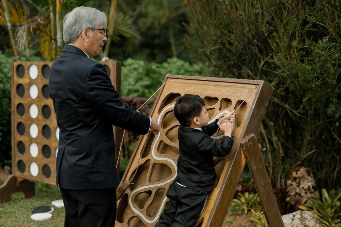 A guest and a small boy at the garden games